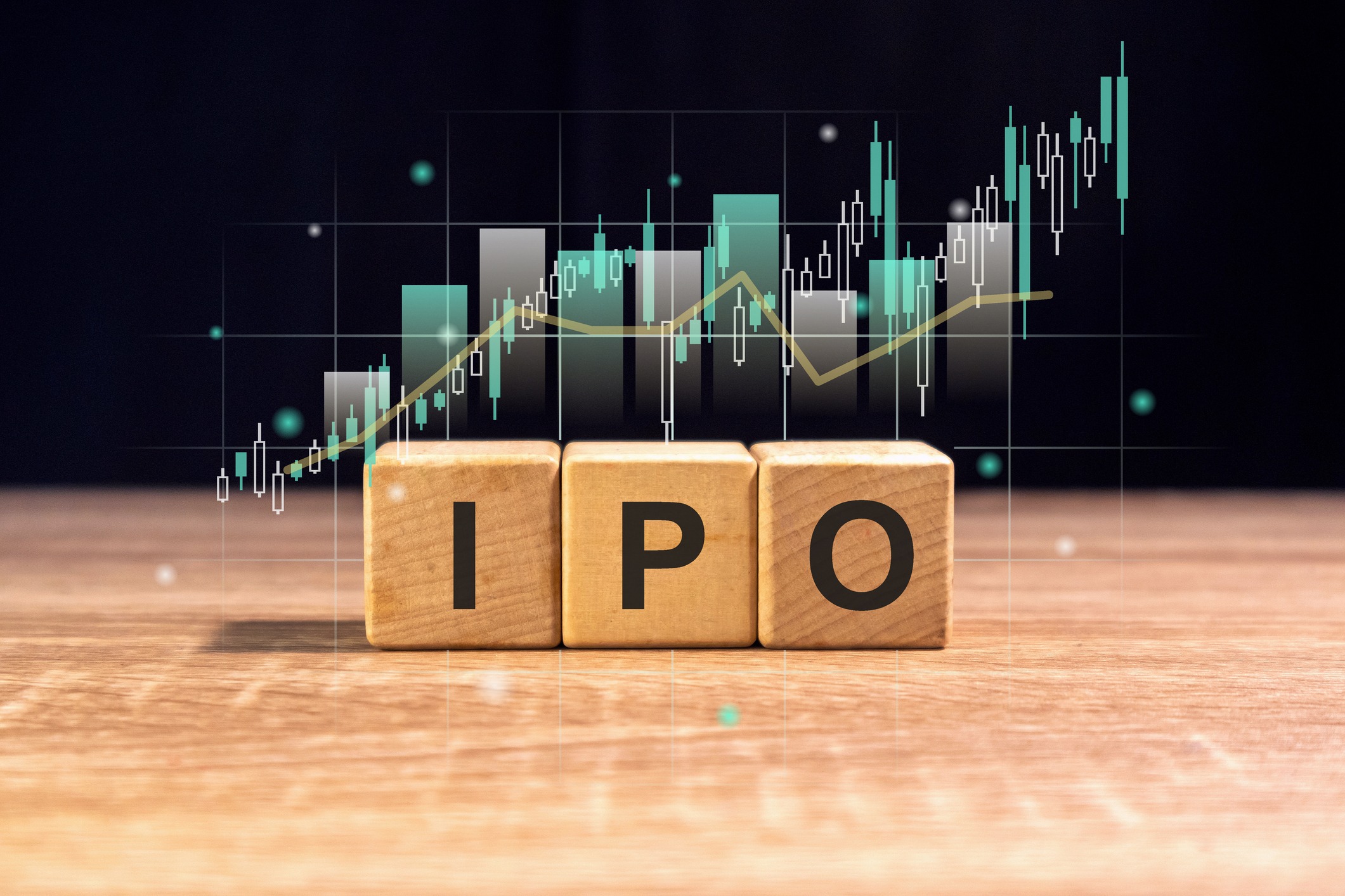 wooden blocks with the word ipo and virtual stock graph. initial public offering or stock launch concept.