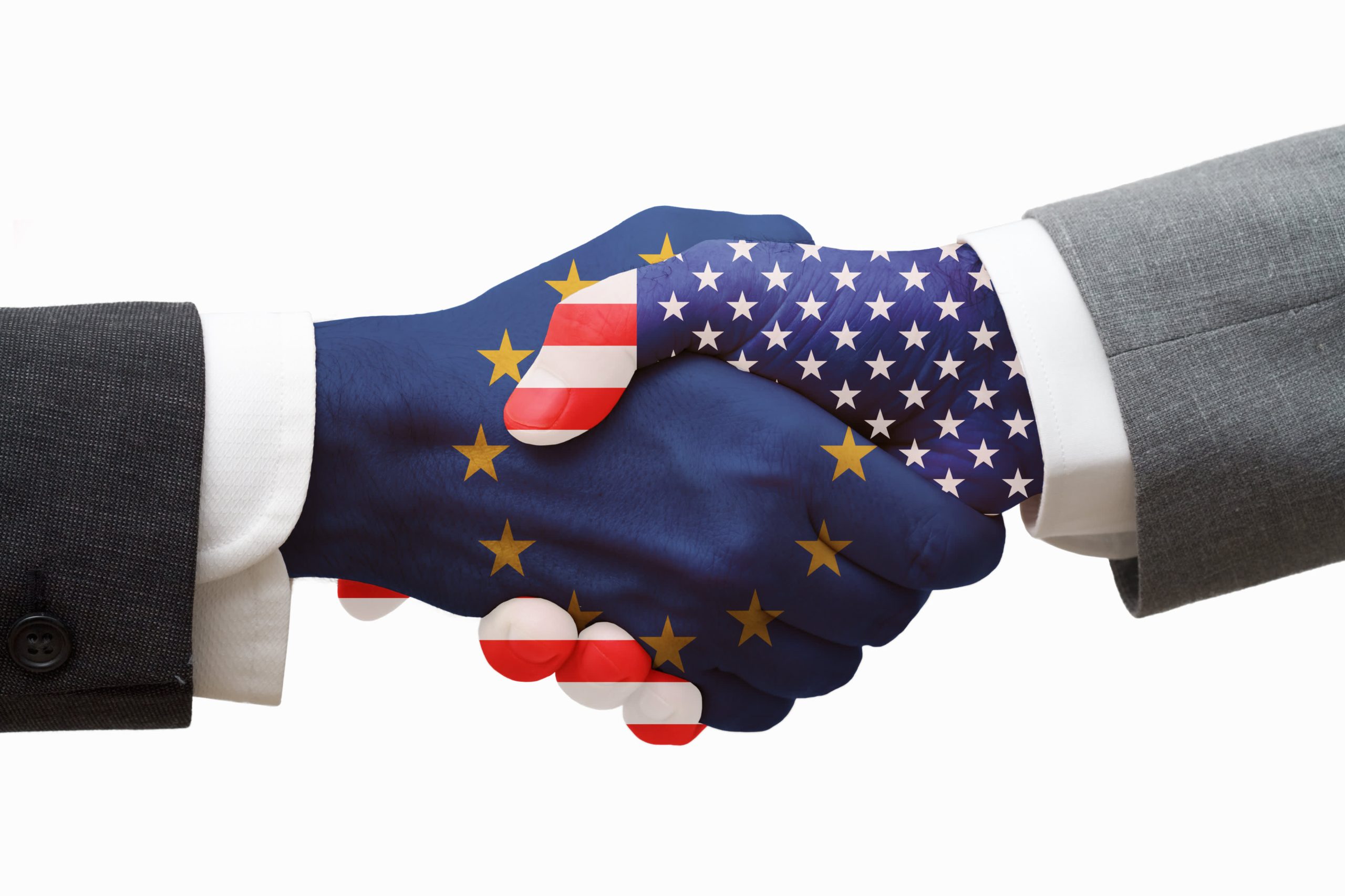 Two hands shaking—one painted with the USA flag, the other with the EU flag—symbolizing a potential trade agreement.