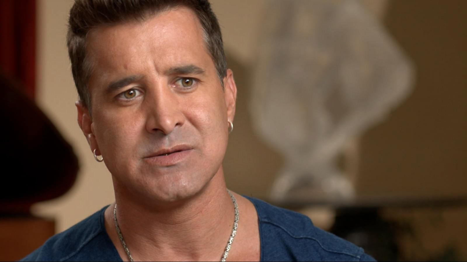 Scott Stapp mid-interview, looking emotional as he discusses his past struggles with addiction and mental health.