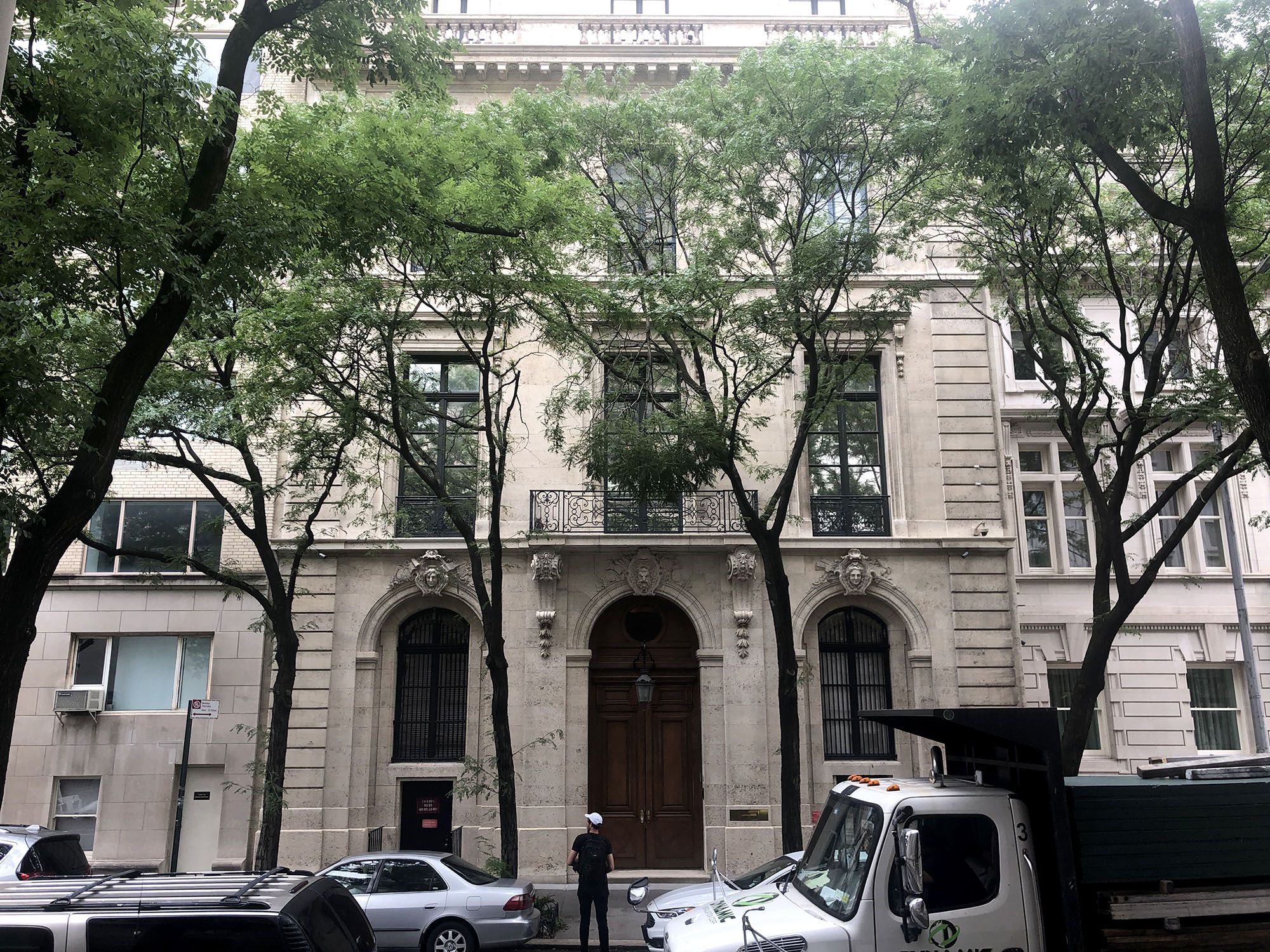 Street-level view of Jeffrey Epstein’s Upper East Side Manhattan mansion, highlighting its classic architecture and imposing facade.