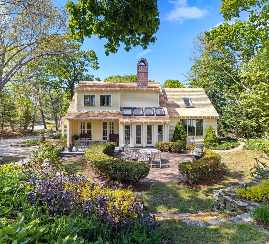 Aerial view of Zach Bryan’s second Massachusetts property, a colonial-style three-bedroom home near Duxbury town center, surrounded by mature trees and manicured lawns.