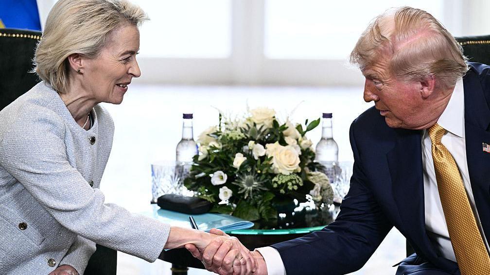 Donald Trump and Ursula von der Leyen shake hands during their trade deal meeting in Scotland.