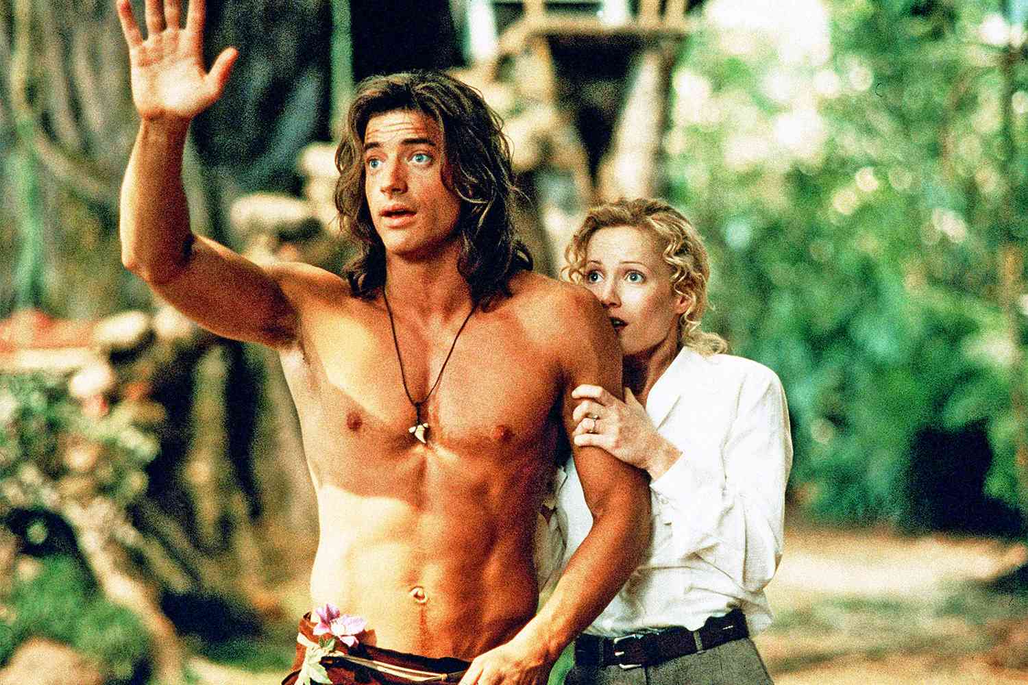 Brendan Fraser swinging through the jungle dressed as George of the Jungle in the 1997 comedy film.