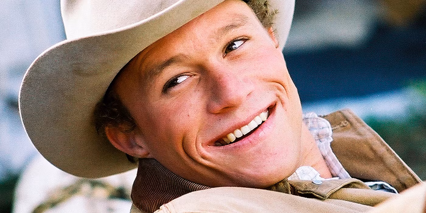 Heath Ledger in Brokeback Mountain, wearing a cowboy hat and gazing solemnly into the distance.