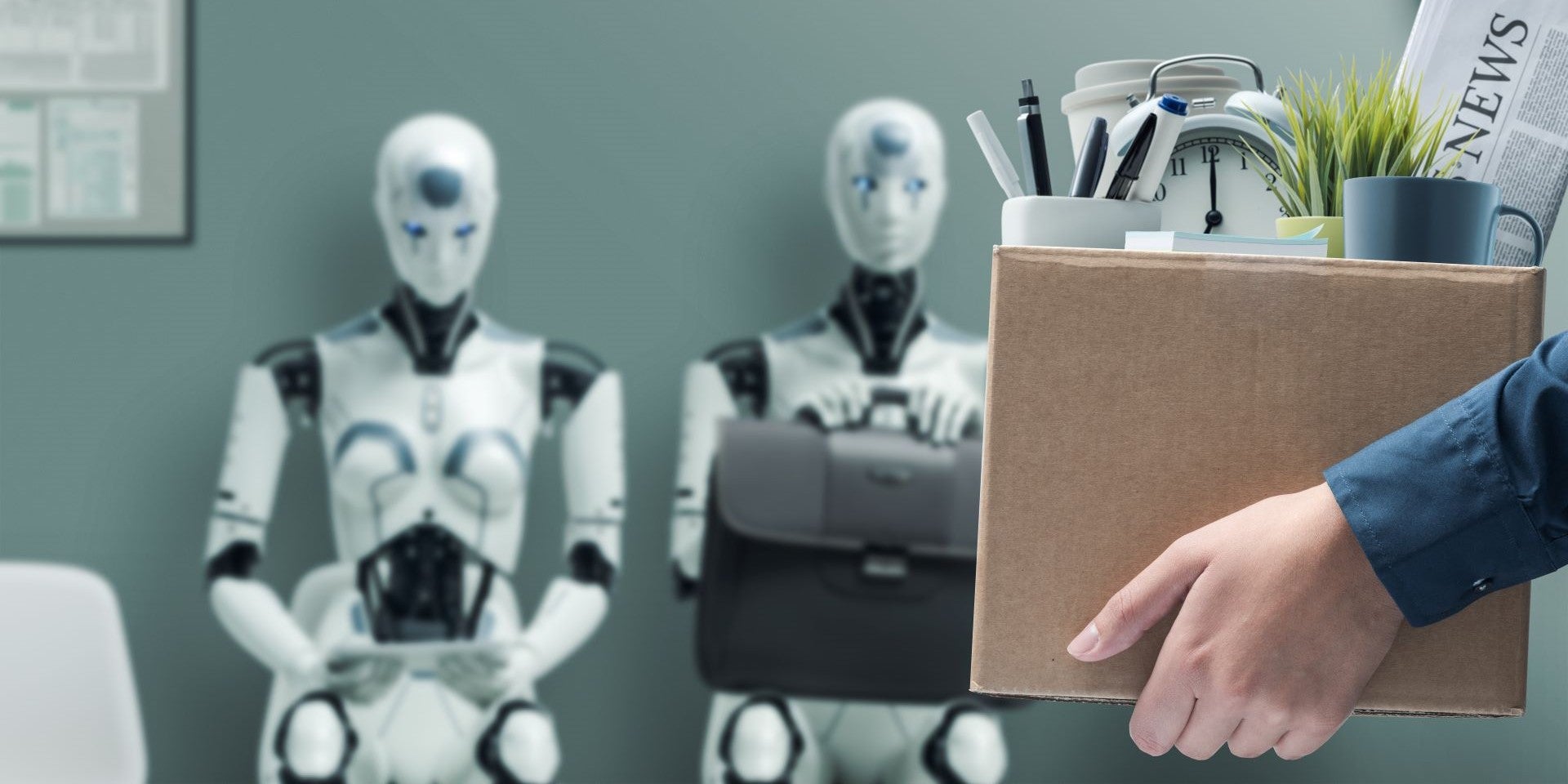 An employee packing up belongings leaving the office while AI robots stand ready to take over their role.