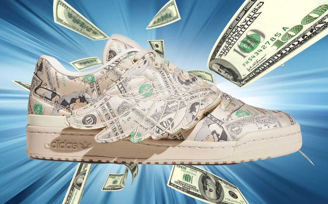 An Adidas trainer covered with scattered U.S. dollar bills, symbolizing rising costs and financial pressures.