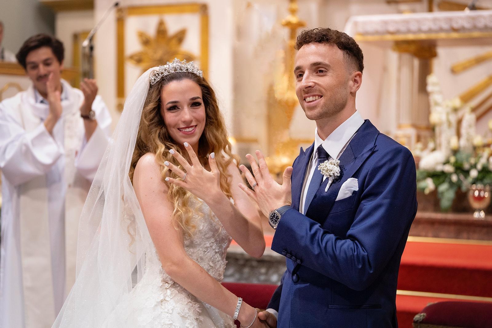 Diogo Jota at his wedding, smiling alongside his wife, celebrating a joyful family moment.