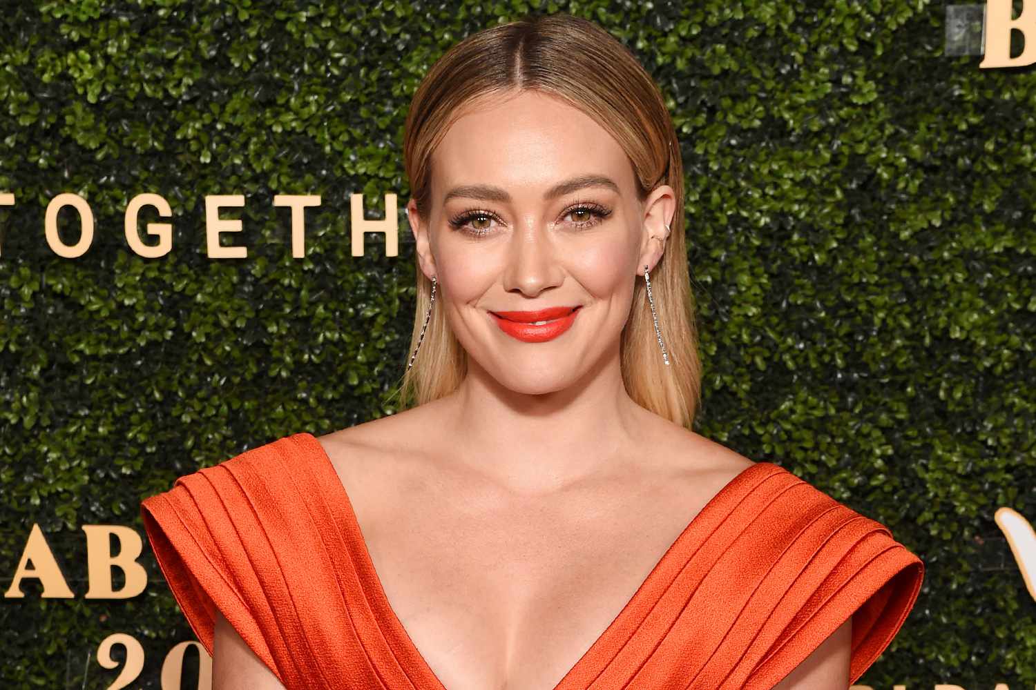 Hilary Duff smiling at a red carpet event in 2025