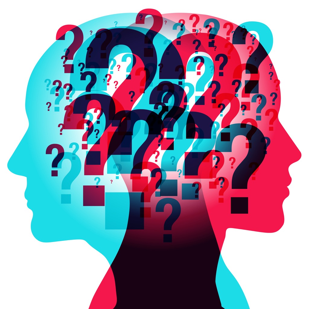 silhouette heads filled with colourful question marks