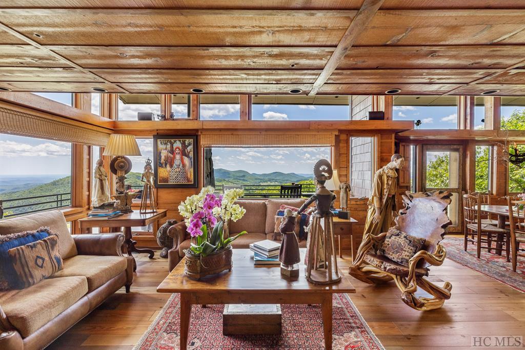 Cozy seating area with modern wood accents and a central coffee table in Burt Reynolds’ former mountain home.