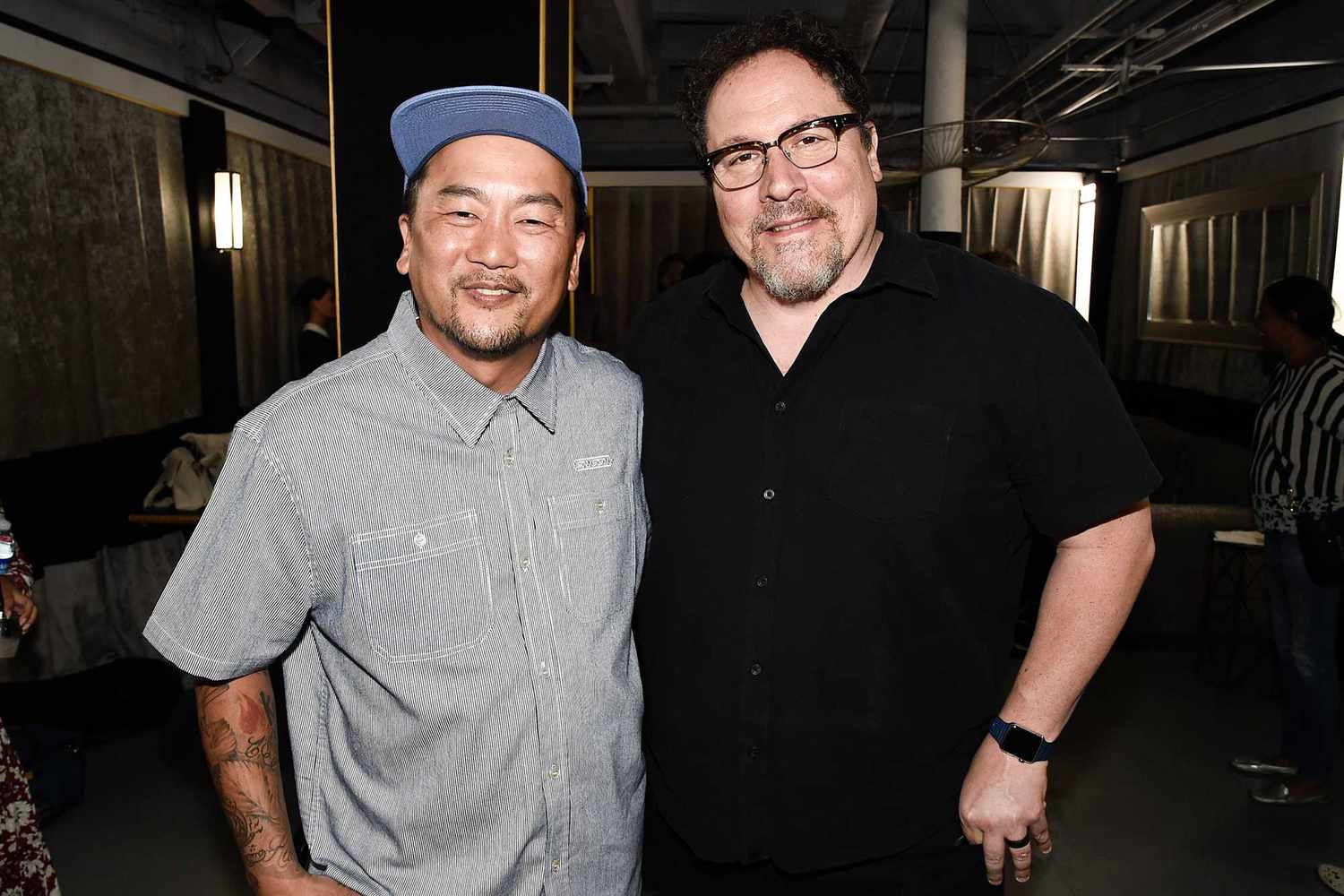 Jon Favreau smiling alongside chef Roy Choi for the camera.