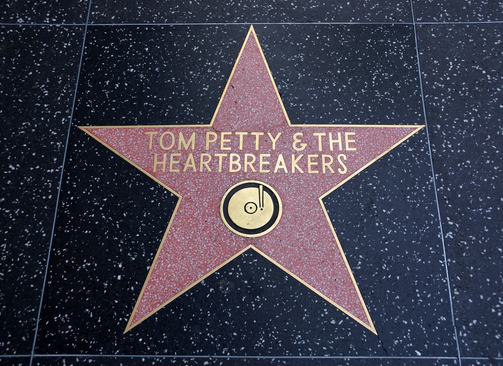 Tom Petty’s Hollywood Walk of Fame star with flowers and fan tributes.