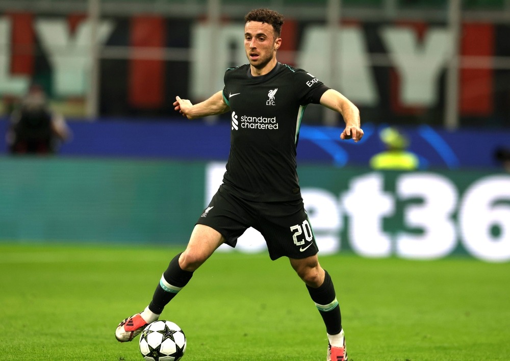 Diogo Jota wearing Liverpool’s black away kit, skillfully controlling the ball during a match.