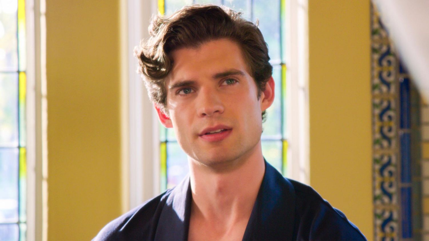 David Corenswet portraying Payton Hobart in The Politician, dressed sharply and delivering an intense expression.