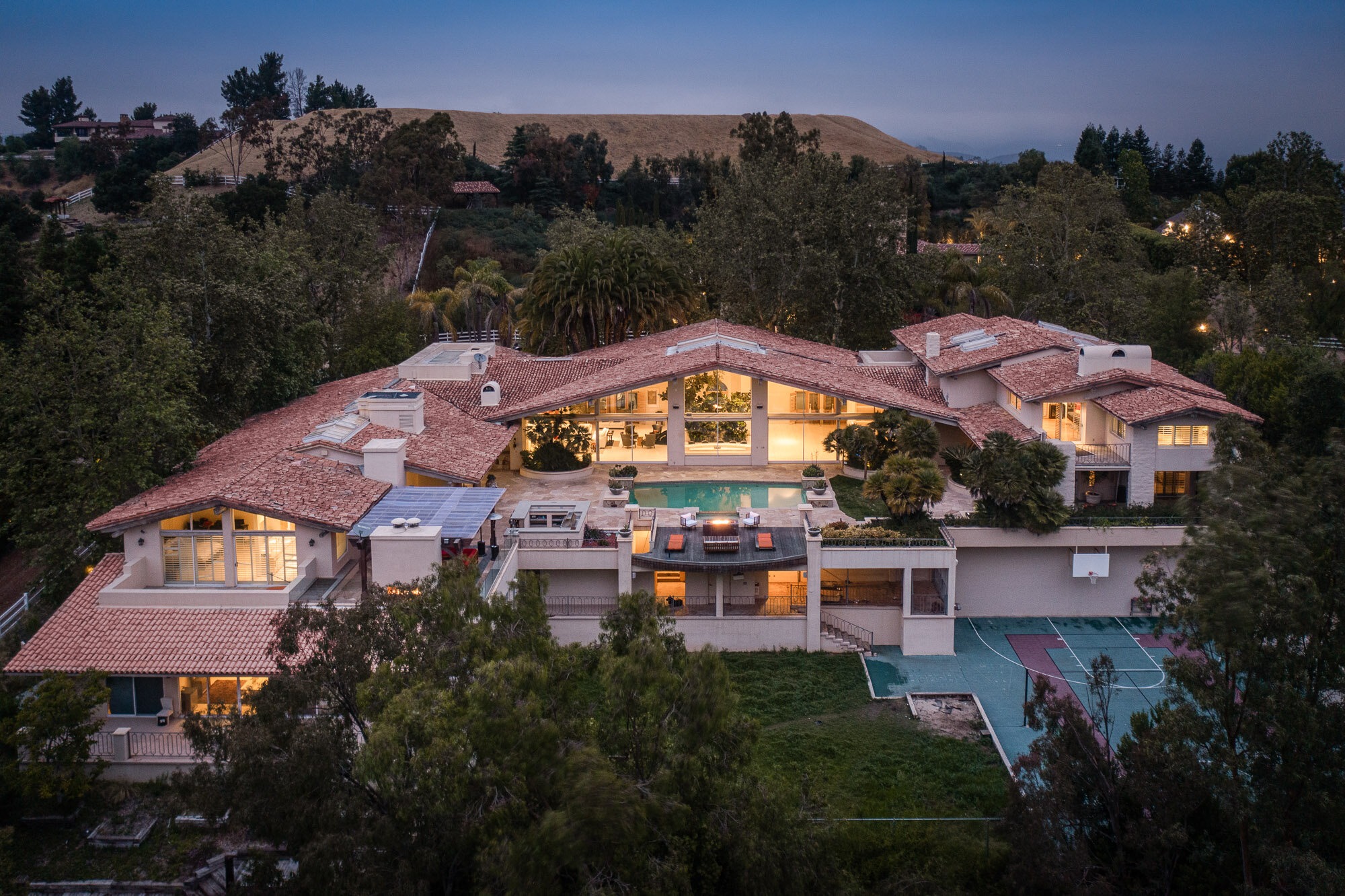 Aerial view of French Montana’s luxurious Los Angeles mansion surrounded by landscaped grounds.