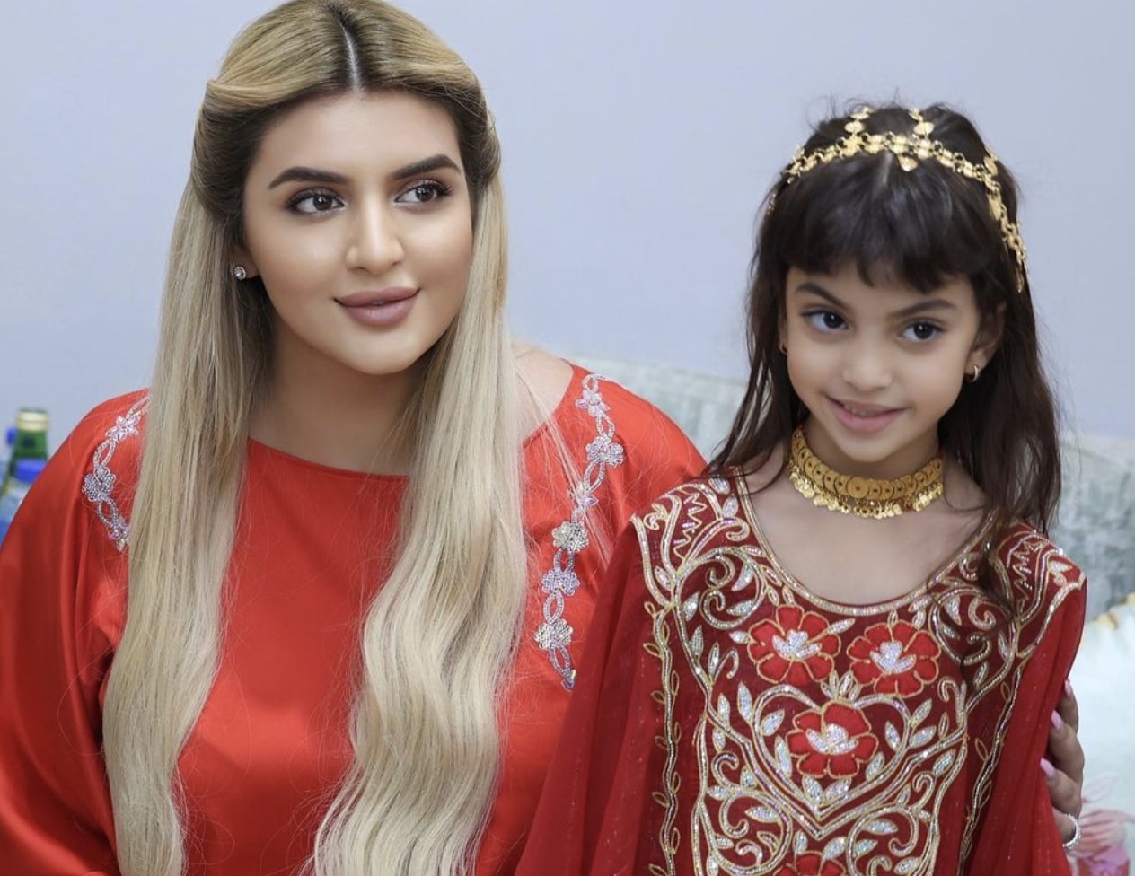 Princess Sheikha Mahra smiling with her daughter while posing for a photo.