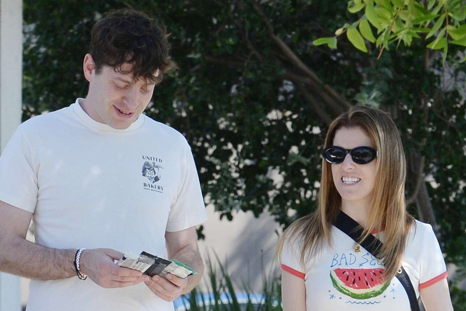 Anna Kendrick walking down the street with her boyfriend, Alex.