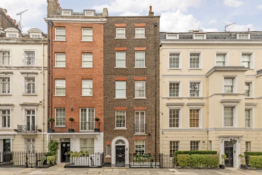 Exterior view of Fred Astaire’s former London home, featuring classic brick architecture and elegant detailing.