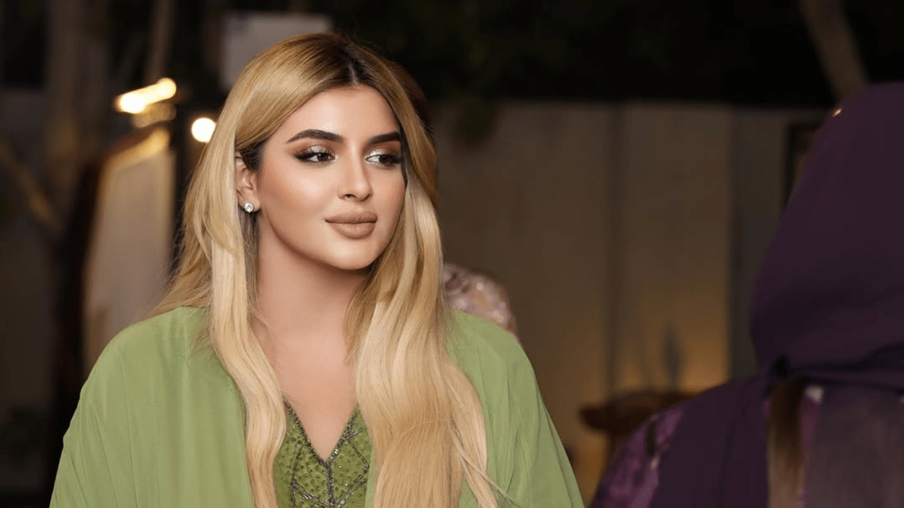 Princess Sheikha Mahra wearing an elegant green dress at a public event.
