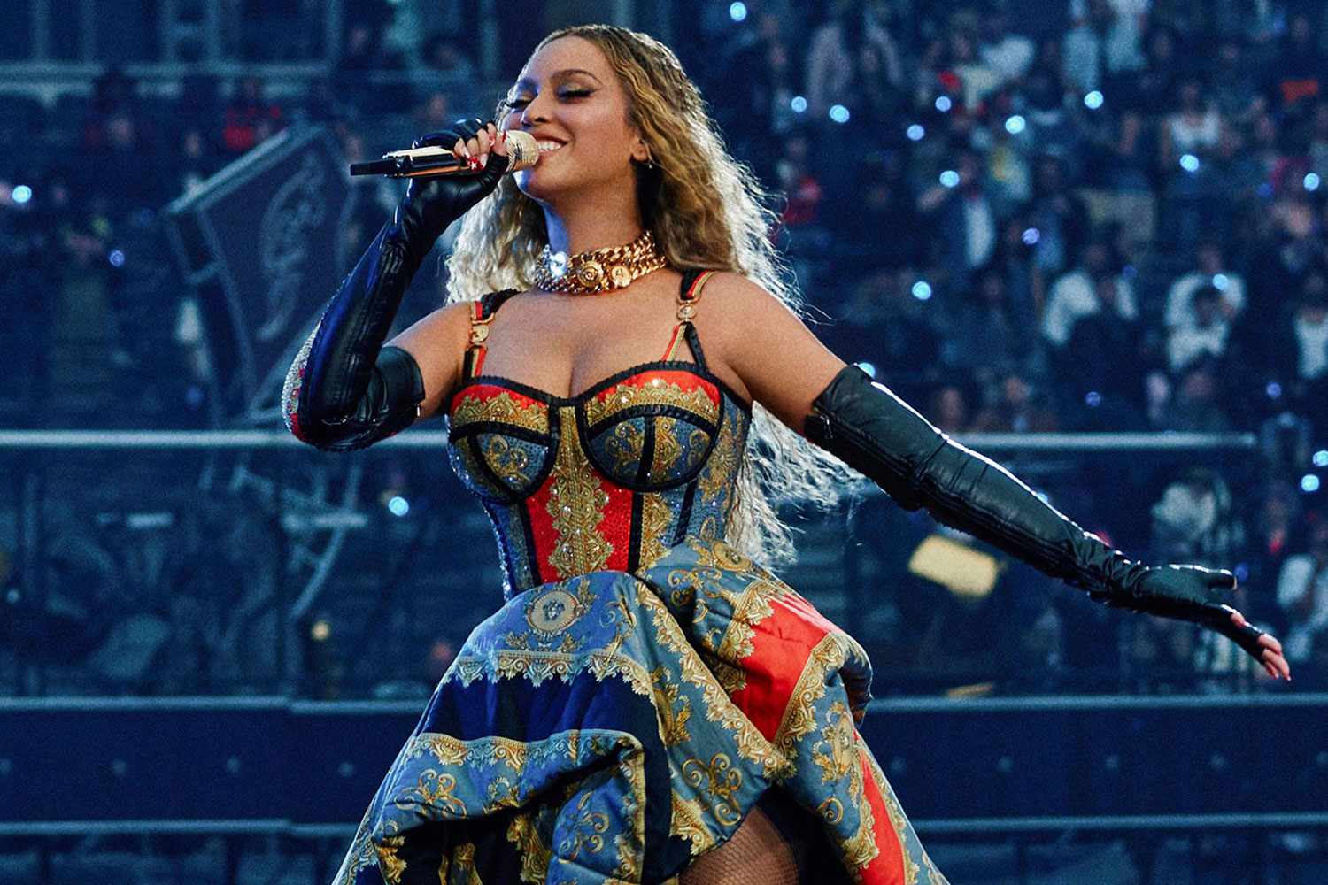 Beyoncé performing during the London leg of her Cowboy Carter tour, dazzling in a custom Donatella Versace outfit.