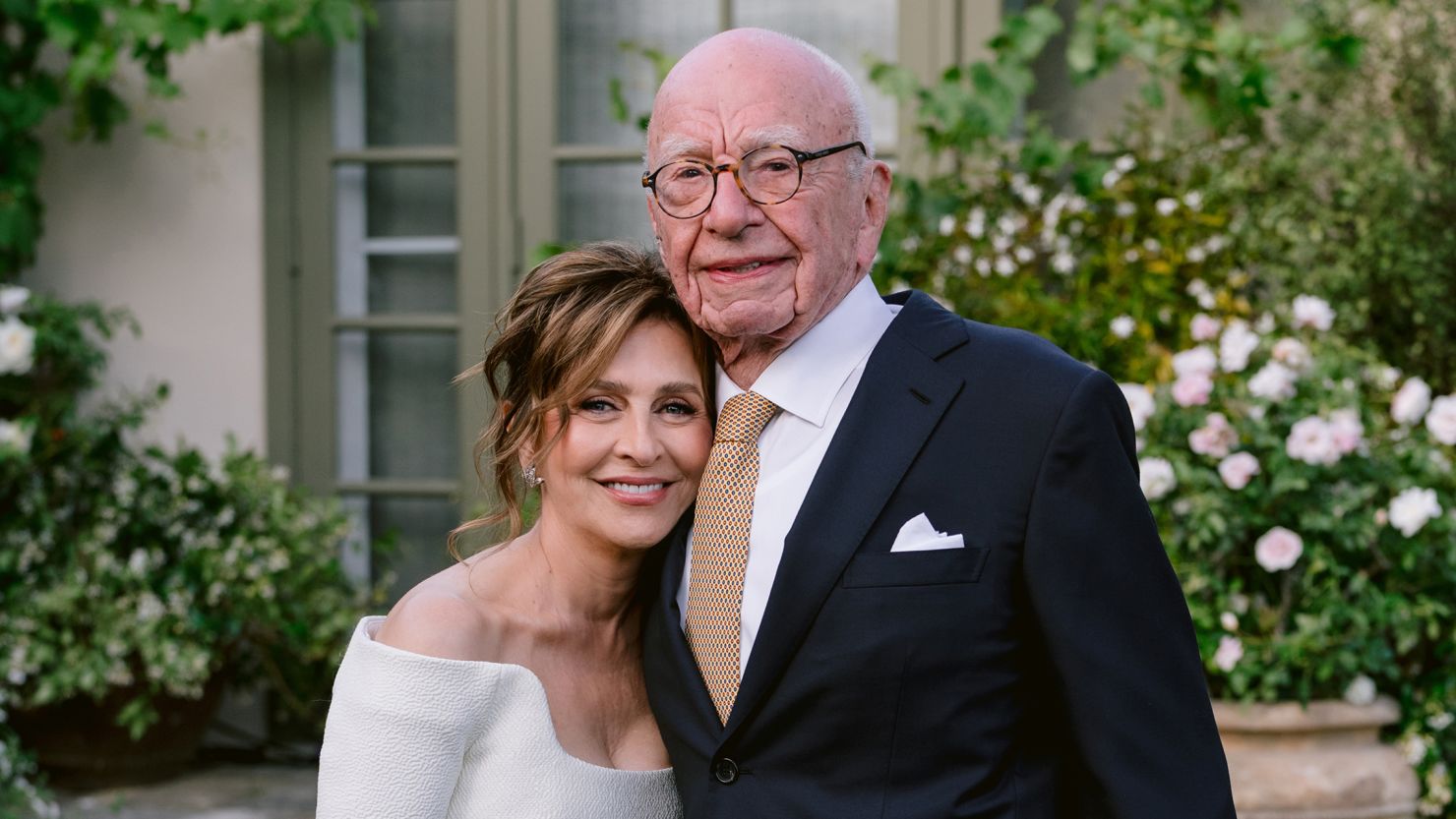 Rupert Murdoch smiling alongside his fifth wife during their wedding ceremony.