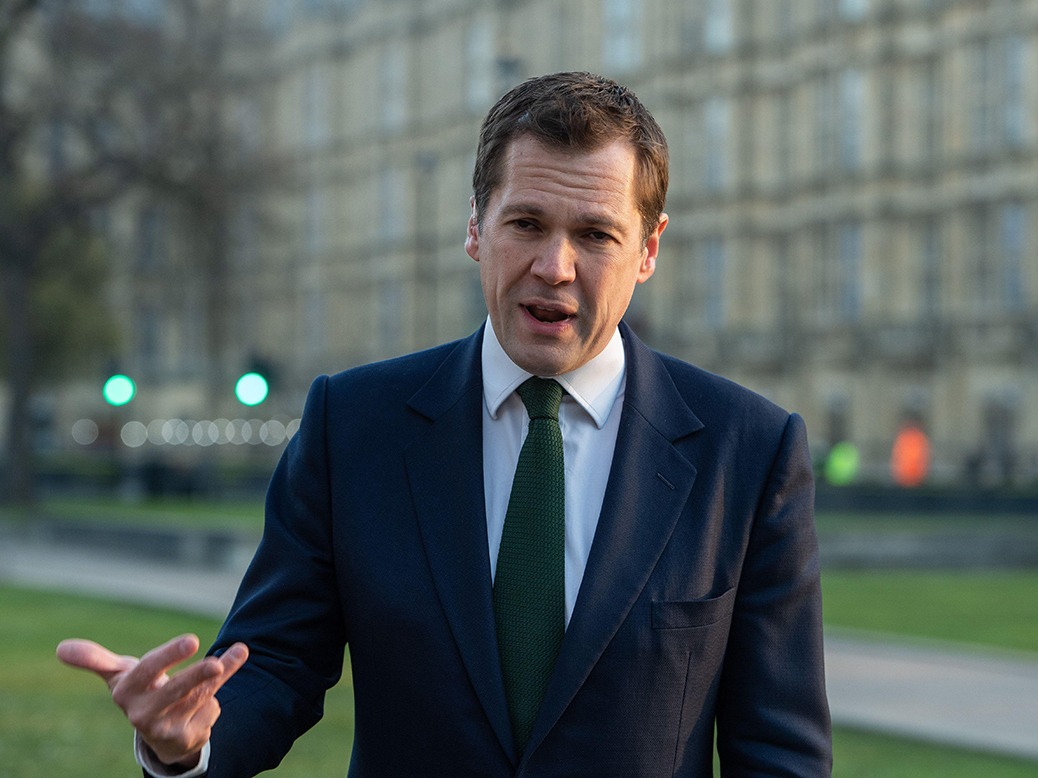 Robert Jenrick being interviewed by journalists outside 10 Downing Street.