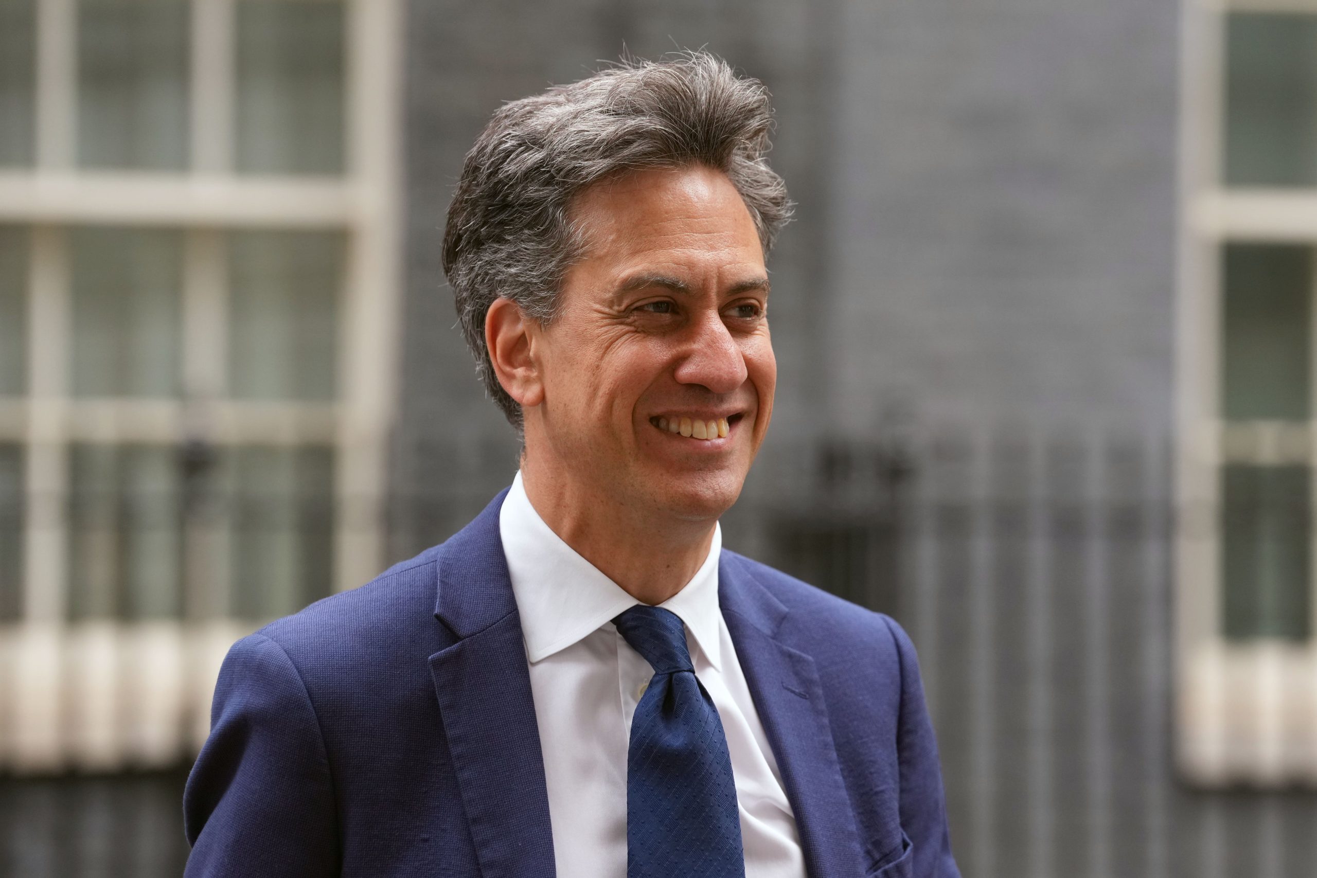 Ed Miliband smiling as he walks down Downing Street, London, September 2025.