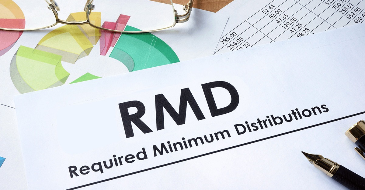 A document labeled “RMD” (Required Minimum Distribution) with a spreadsheet in the background showing retirement account balances and calculated withdrawal amounts.