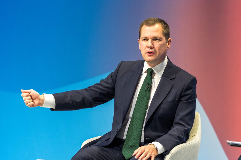 Robert Jenrick speaking to the audience on a political television programme.