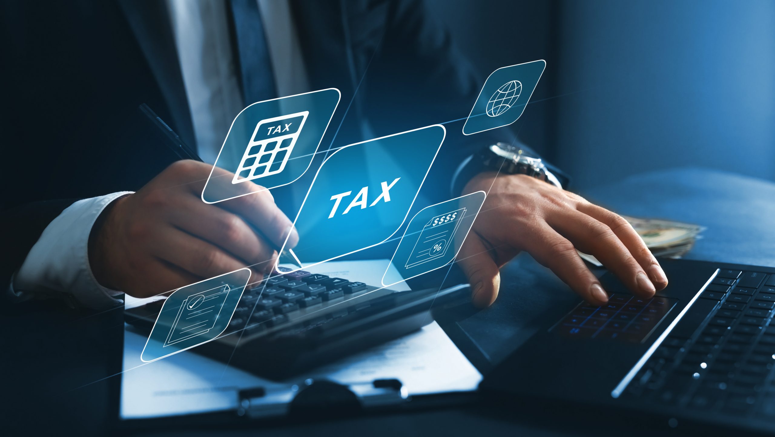 A man calculating finances with a pen and calculator, while a holographic “TAX” projection floats above him.