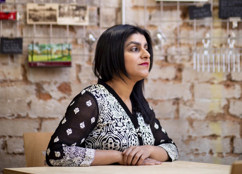 Shabana Mahmood MP sat at a table in the Jewellery Quarter, Birmingham.
