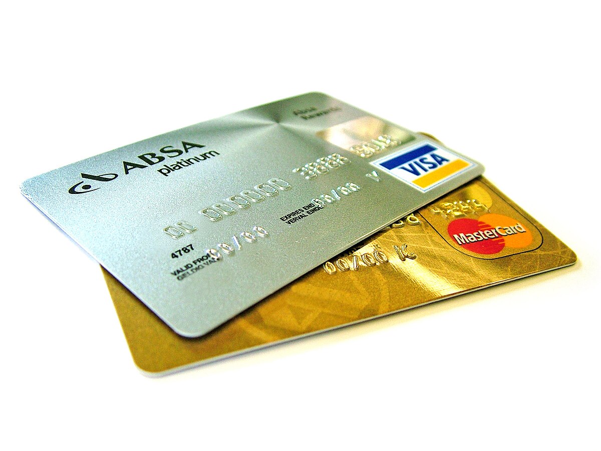 Two credit cards stacked on top of each other on a flat surface, symbolizing credit building and financial management.