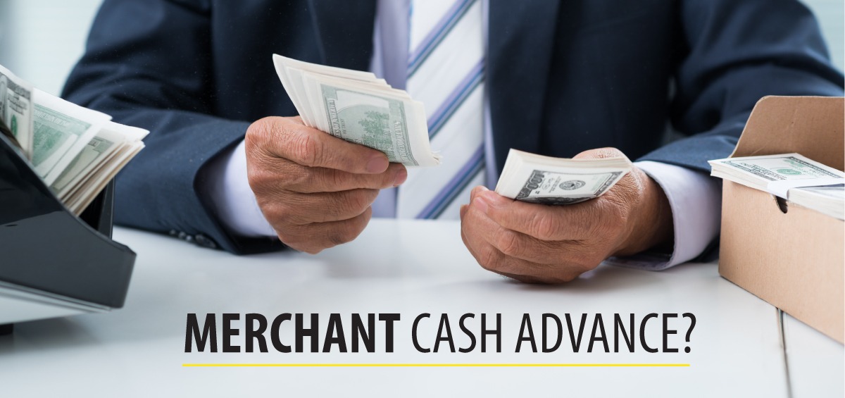 A businessman holding U.S. dollar bills with the text "Merchant Cash Advance," symbolizing fast business financing options.