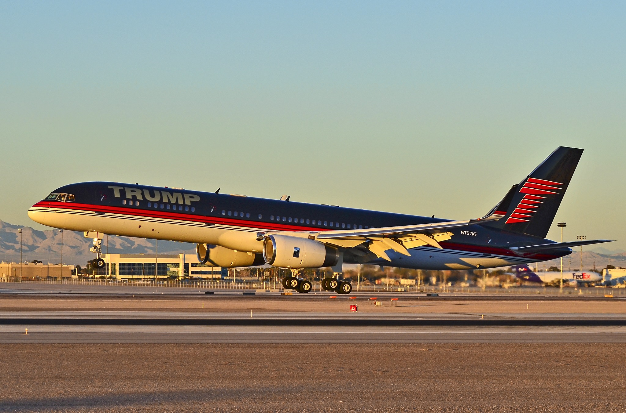 Donald Trump’s customized Boeing 757, known as Trump Force One, taking off on a runway.