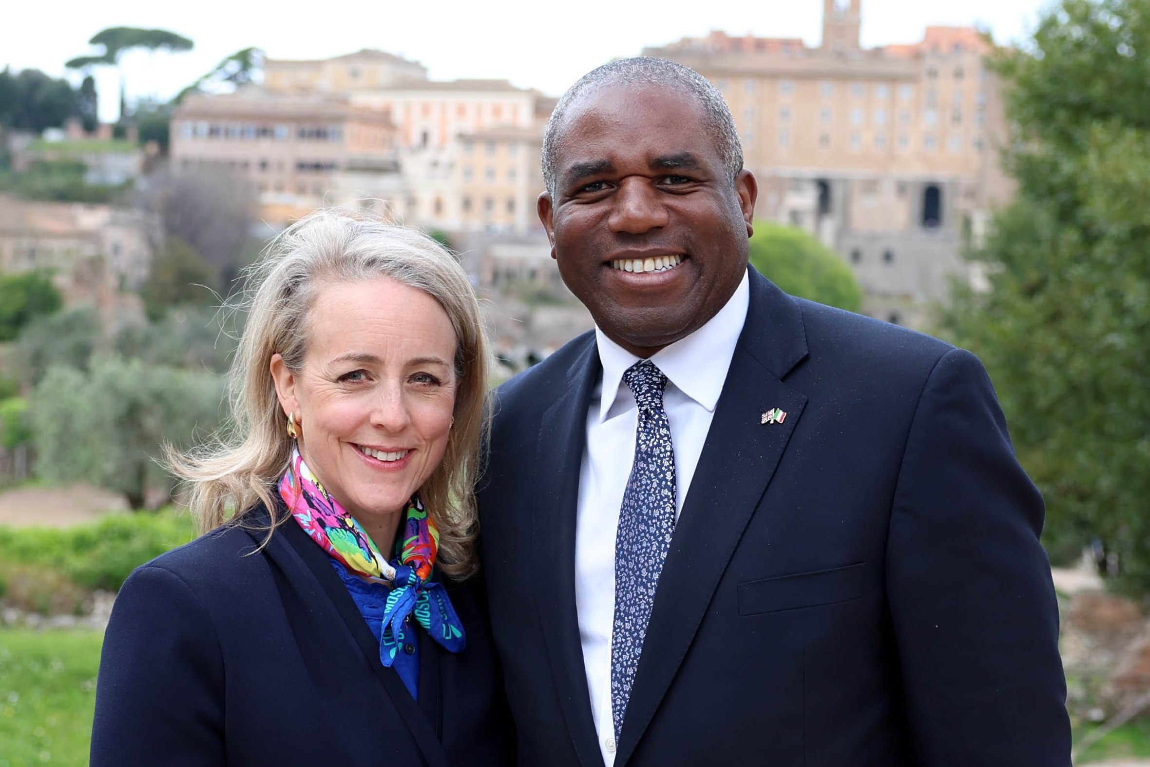 David Lammy and his wife smiling together for a photo.
