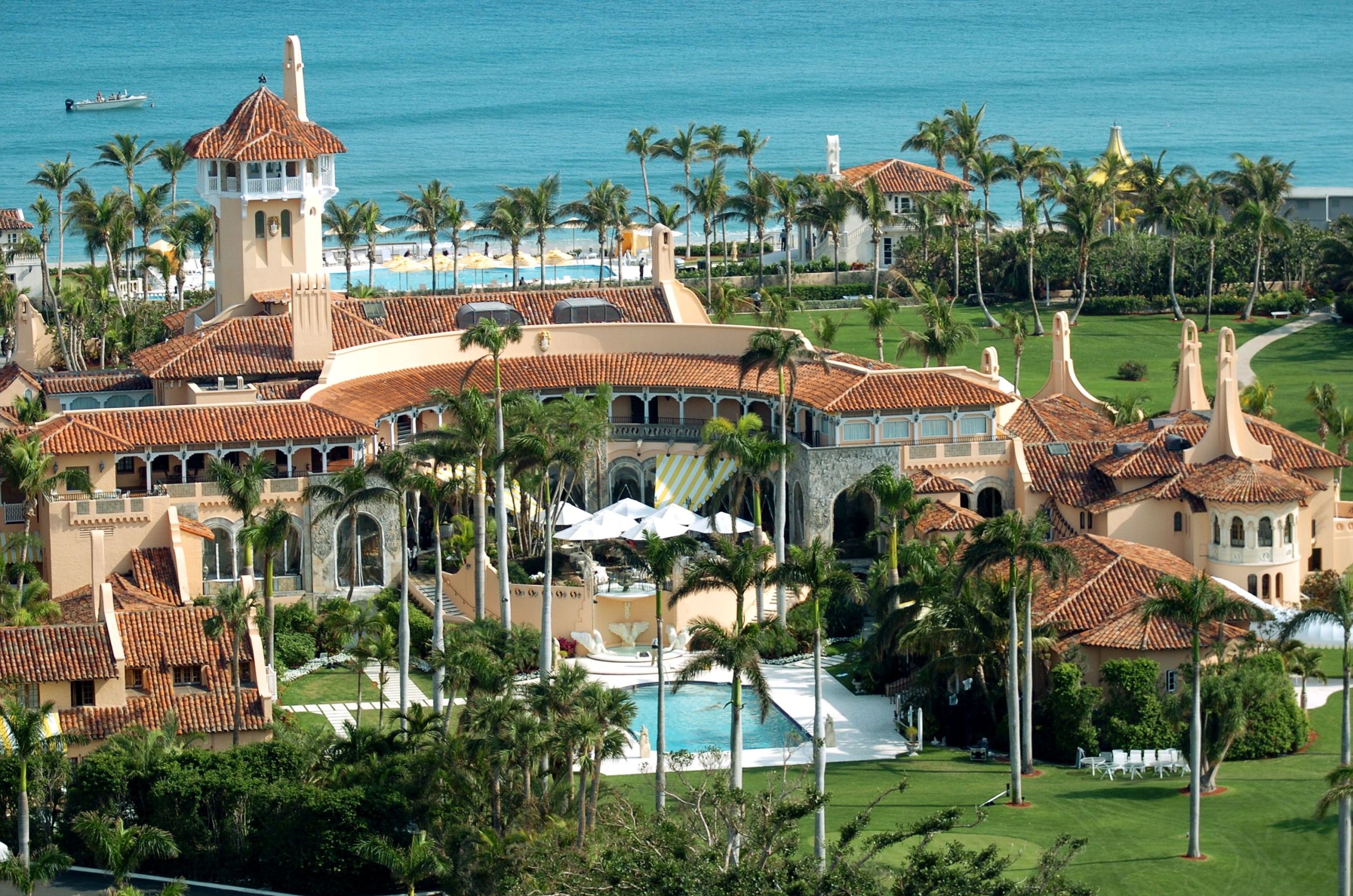 Aerial view of Mar-a-Lago estate in Palm Beach, Florida, showing the mansion, gardens, and coastline.