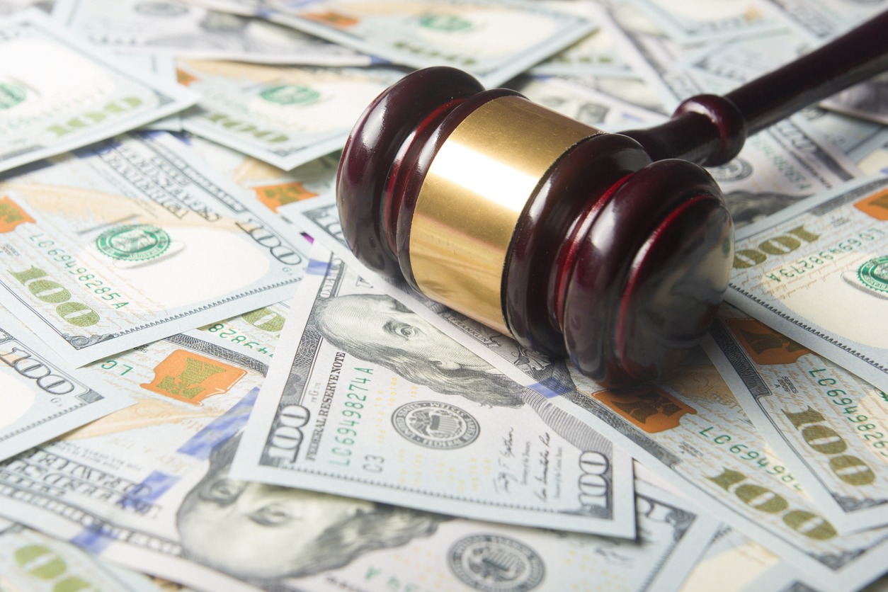 judges or auctioneer gavel on the dollar cash background, top view, close up. concept for corruption, bankruptcy, bail, crime, bribing, fraud, auction bidding, fines