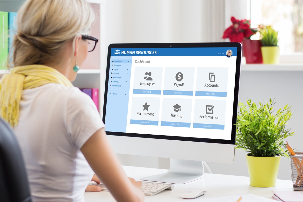 woman working with human resources software on computer