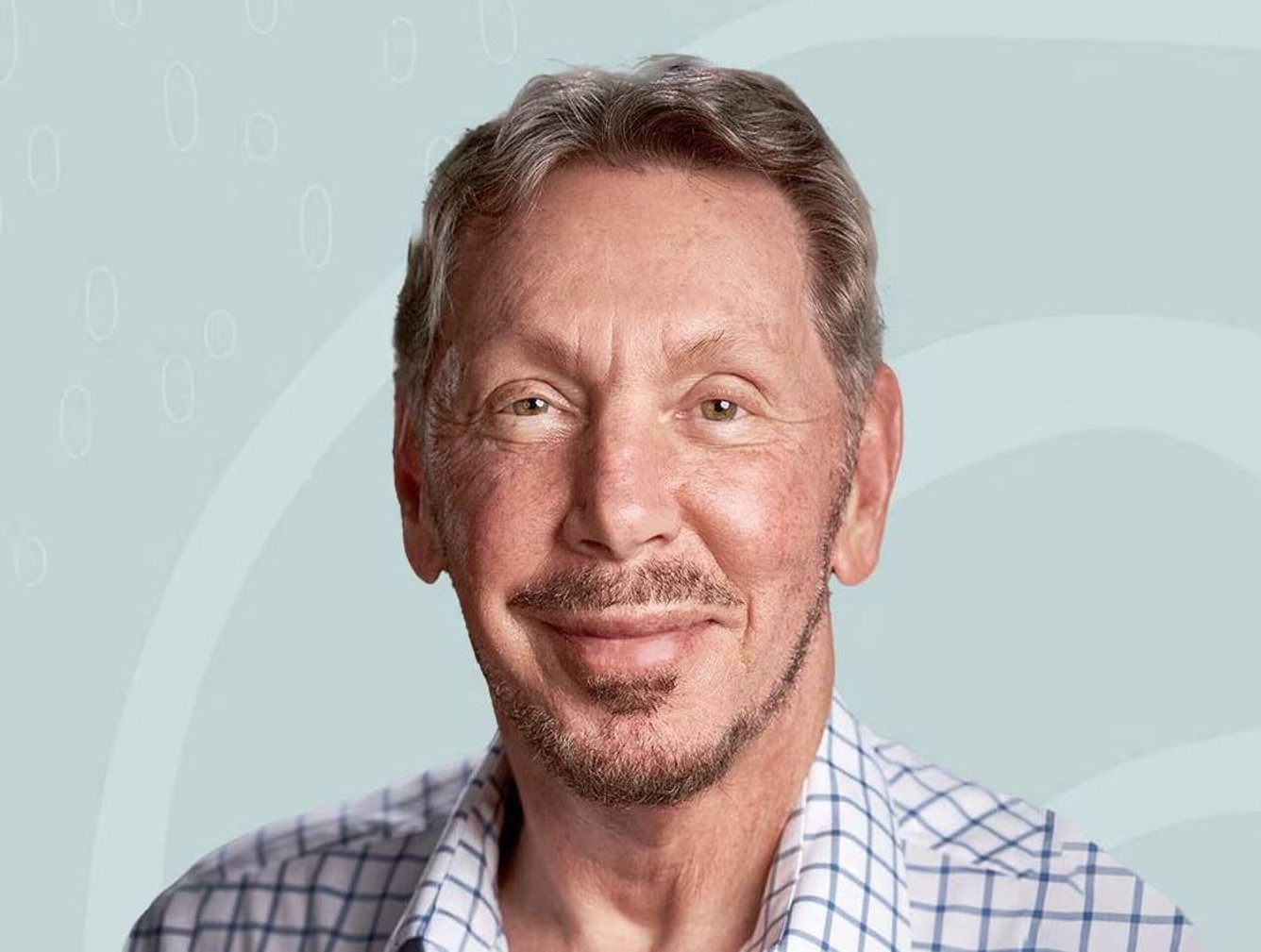 Larry Ellison smiling confidently during a professional photoshoot.