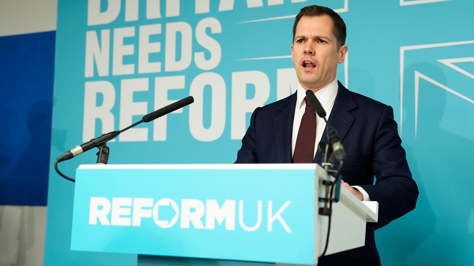 Robert Jenrick delivering a passionate speech on stage at his Reform UK unveiling event in January 2026