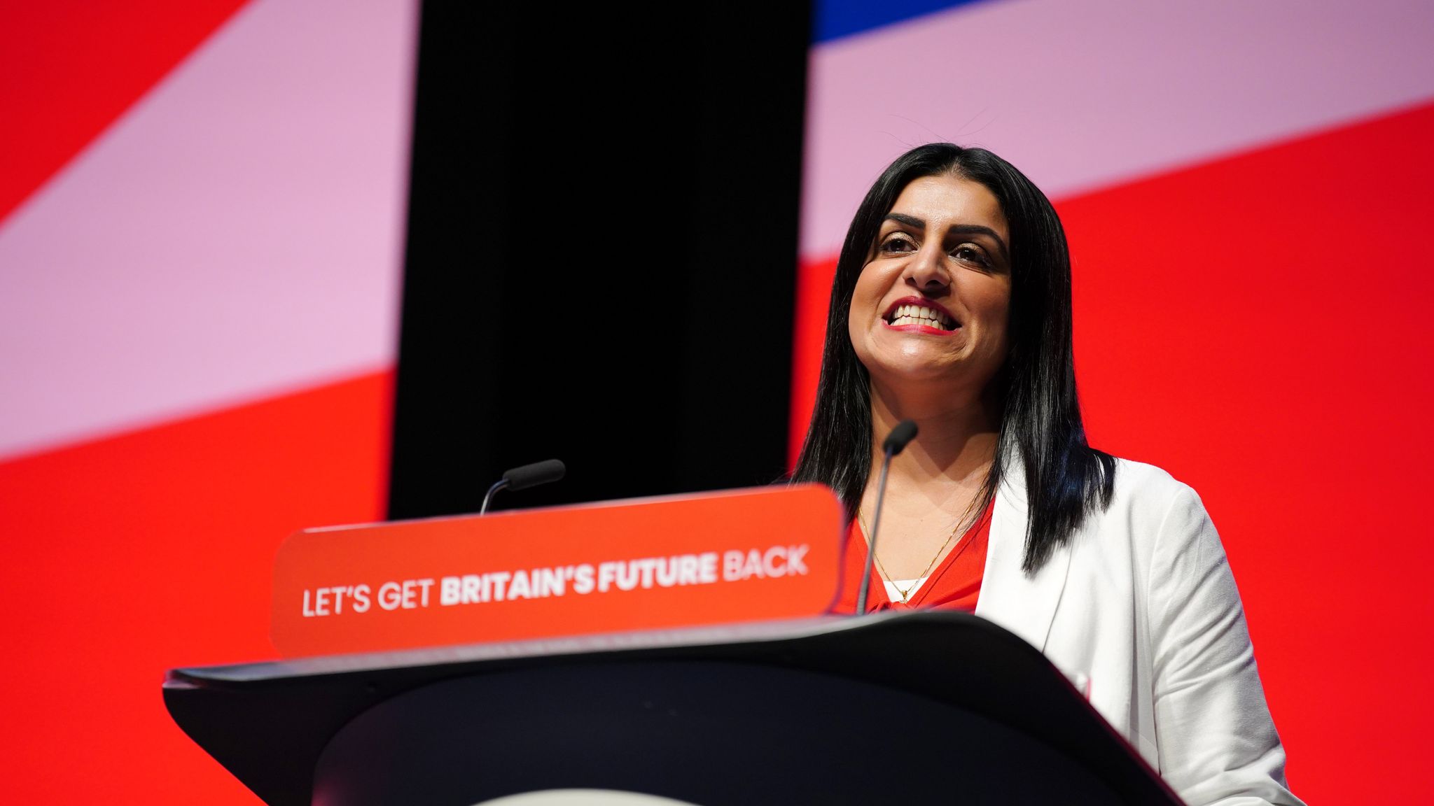 Shabana Mahmood delivering a speech on stage at the Labour Party Conference.