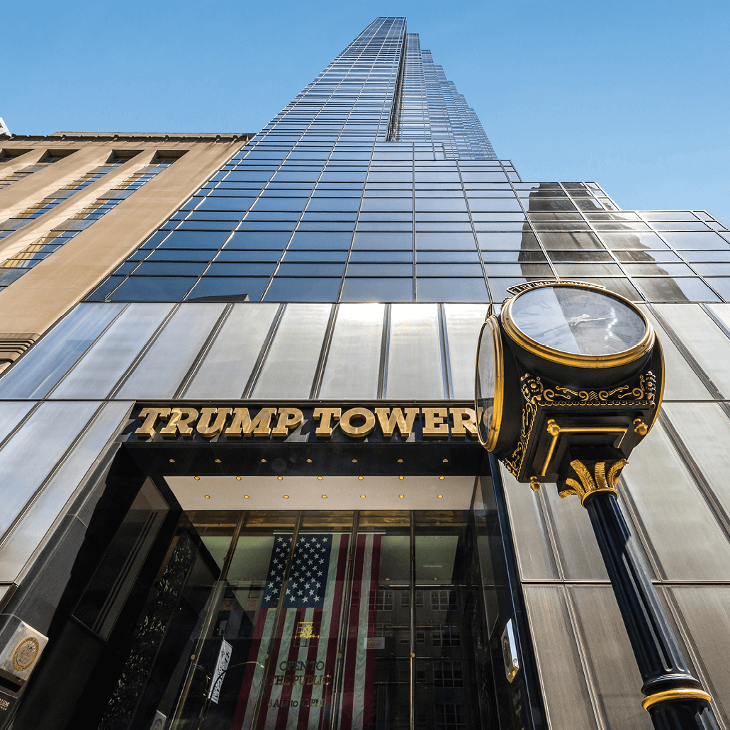Exterior view of Trump Tower in New York City, a skyscraper with reflective glass and gold accents.