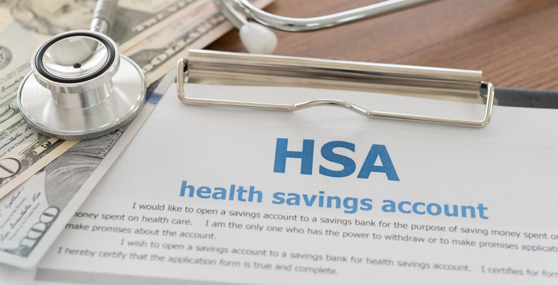 HSA document on a clipboard with a stethoscope placed nearby, symbolizing healthcare and retirement planning.