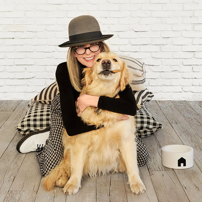 Diane Keaton cuddling her golden retriever Reggie in her mansion