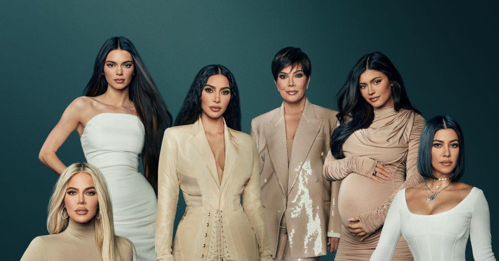 Promotional poster featuring the Kardashian family posing together for The Kardashians Hulu series.