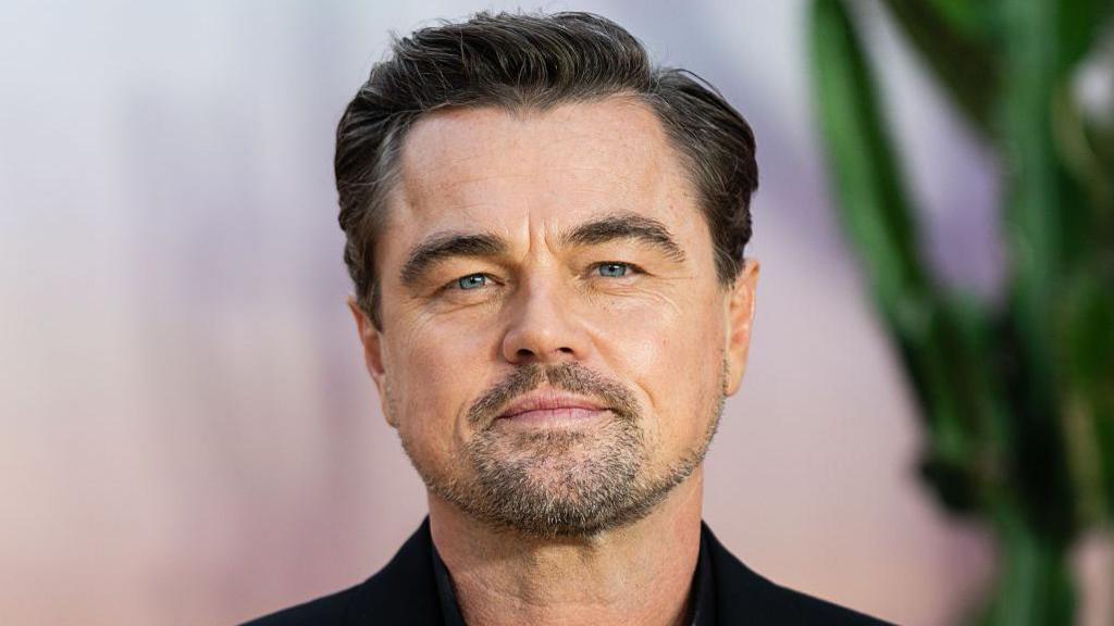 Leonardo DiCaprio at a film premiere in 2025, promoting One Battle After Another, the politically charged drama directed by Paul Thomas Anderson.