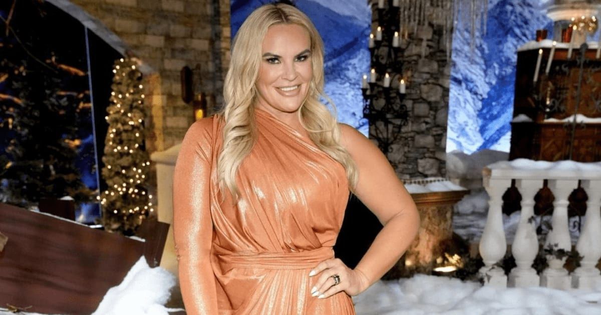 Heather Gay dressed glamorously at a Christmas party, wearing festive attire and styled hair, smiling for the camera.