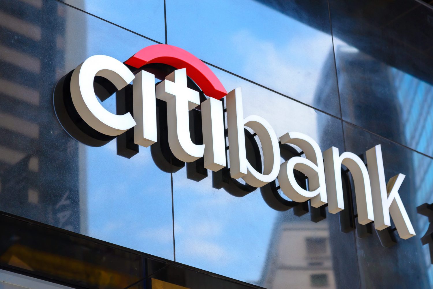 Citibank logo displayed prominently on the exterior of a modern office building.