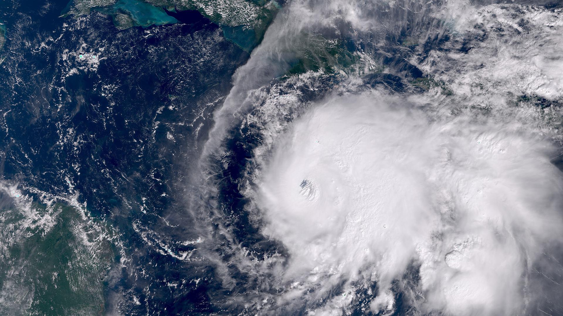Satellite image of Hurricane Melissa approaching Jamaica, showing its massive cloud coverage and intense eye.