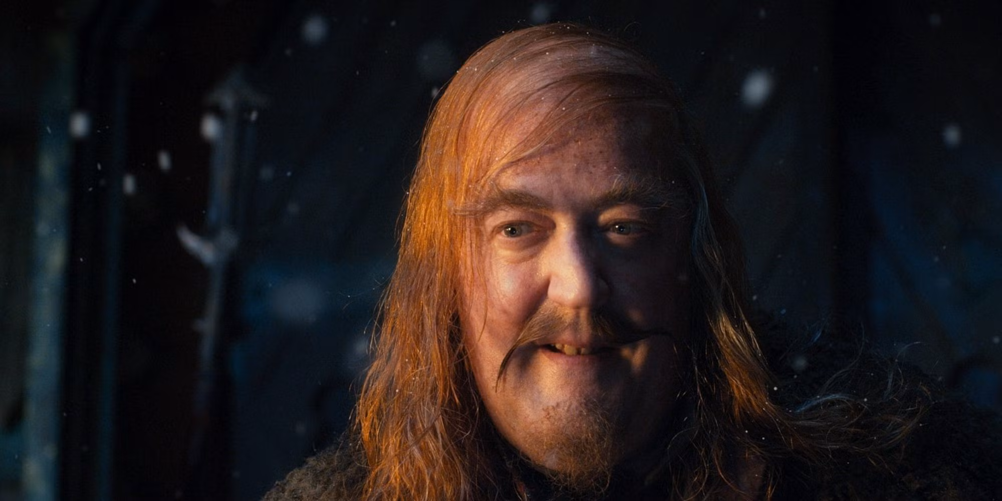 Stephen Fry as the Master of Lake-town in The Hobbit: The Desolation of Smaug, dressed in elaborate period costume with a commanding expression.